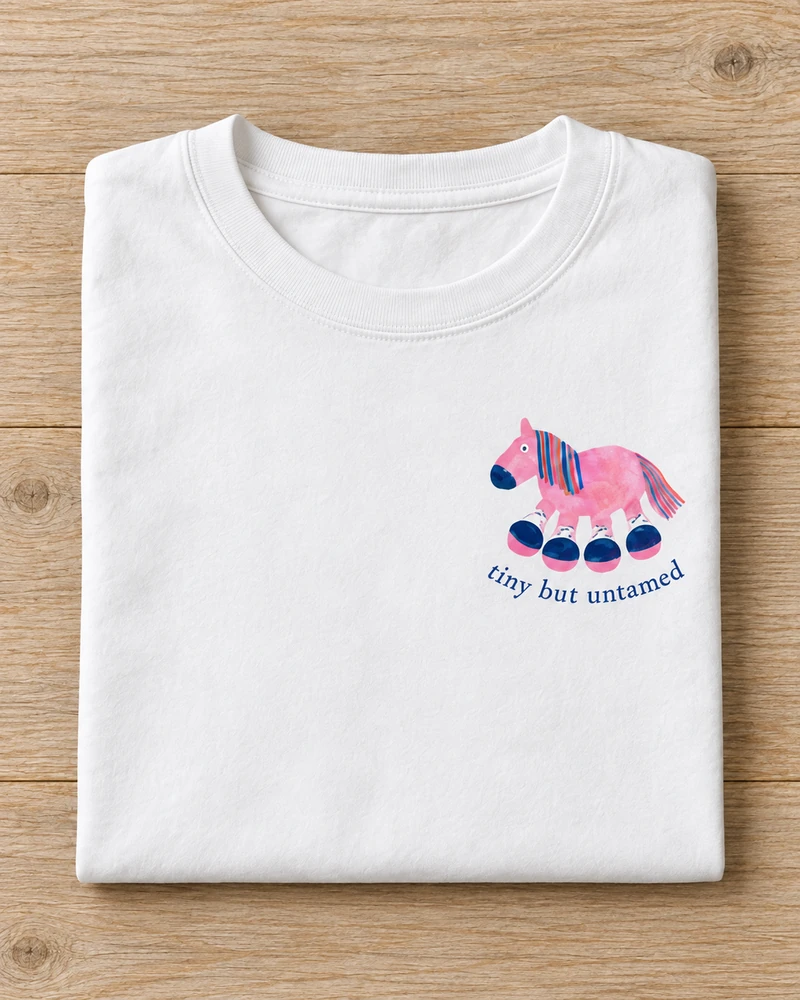 Folded white cotton Tiny but Untamed Pony T-Shirt