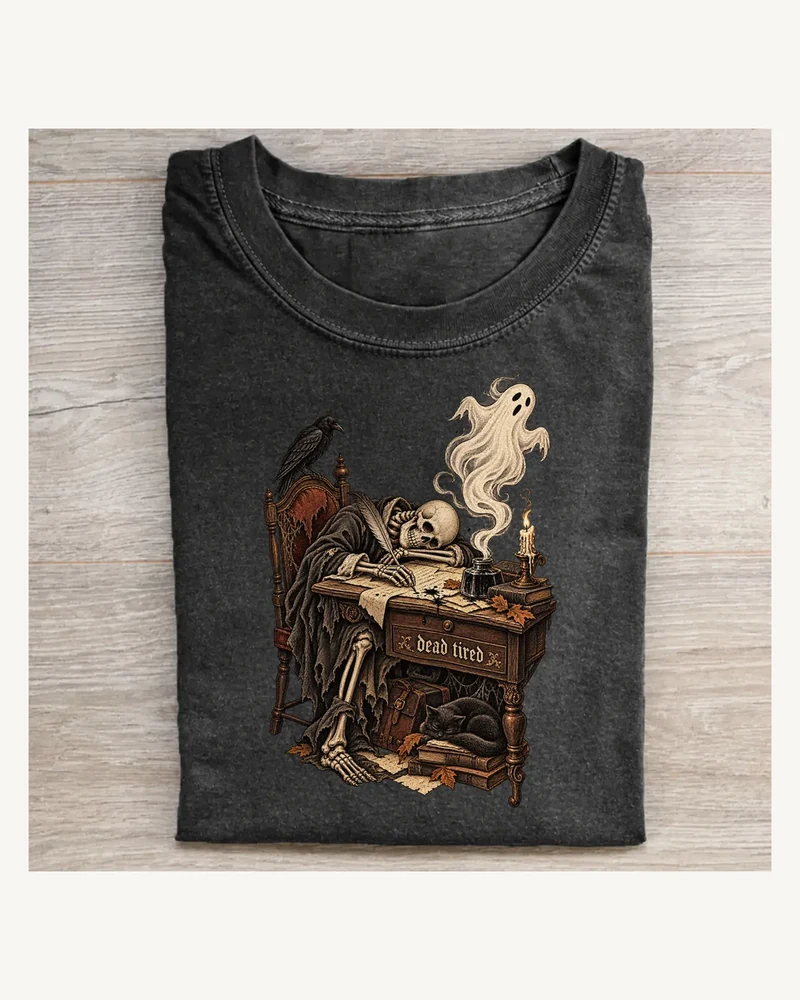 Folded washed black T-shirt featuring Dead Tired gothic artwork