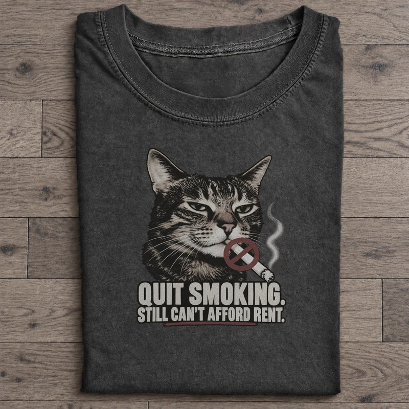 Quit Smoking Still Broke Graphic T-Shirt on washed-black cotton T-shirt