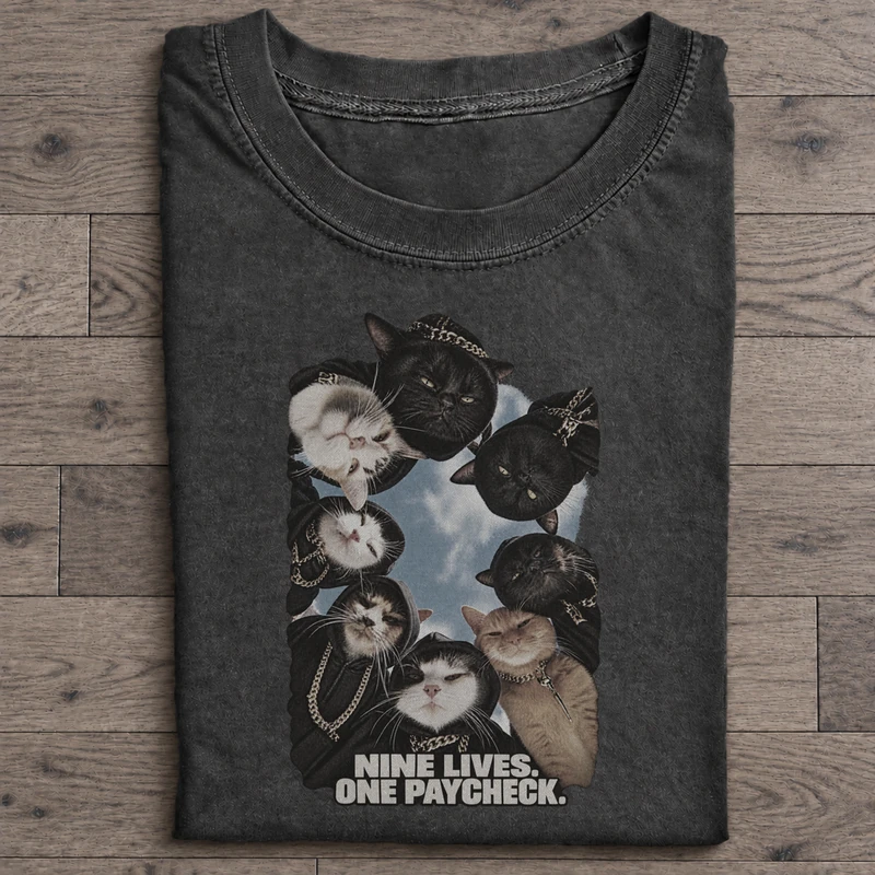 Nine Lives One Paycheck Graphic T-Shirt on washed-black cotton T-shirt