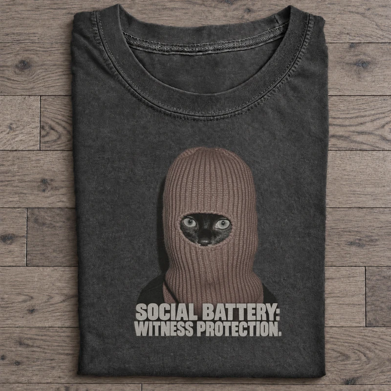 Social Battery Witness Protection Graphic T-Shirt on washed-black cotton T-shirt