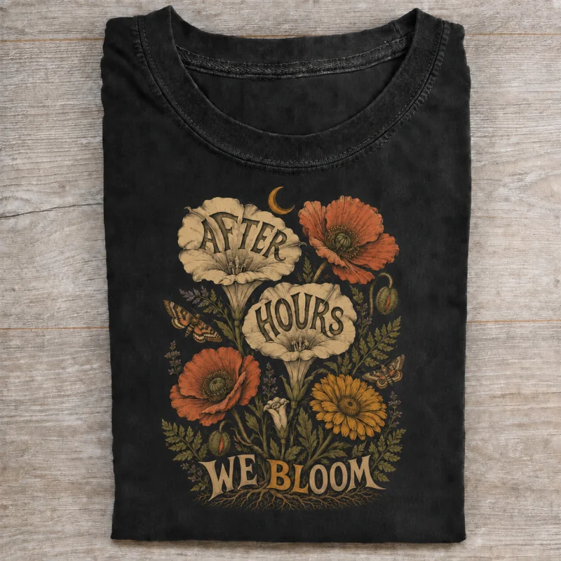 Folded washed black T-shirt with after hours we bloom artwork